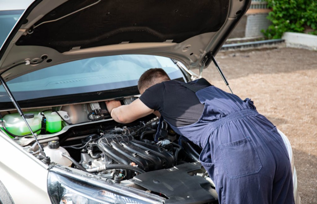 Passenger vehicle hood service